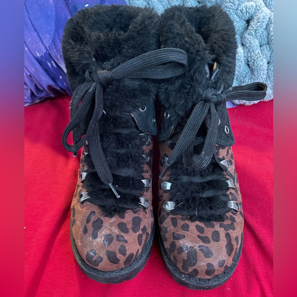 Woman's size 6 winter boot. Leopard print with black fur around the top.